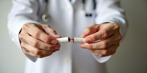Doctor breaking a cigarette to symbolize quitting smoking, promoting a healthy lifestyle and addiction recovery now.
