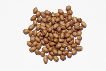 raw peanut against white background