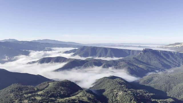 Fog rolling over Osona valley in Barcelona, Spain