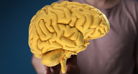 A 3D golden brain model represents intellect, creativity, and problem-solving. Perfect for business, technology, and education.
