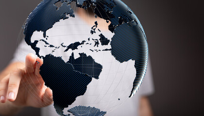 High-quality stock photo of a hand interacting with a digital 3D model of Earth, symbolizing global...