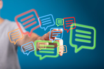 Fototapeta premium Hand interacting with digital chat bubbles,communication, messaging, social media concept.