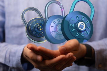 Image of three digital combination locks floating above hands, representing data security and...