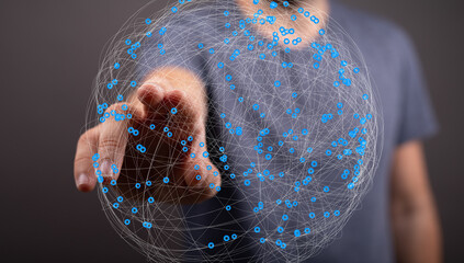 Person touching a digital globe, illustrating global network, connection, and technology.