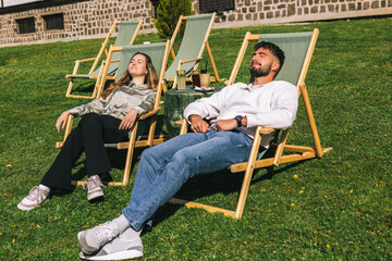 Young Couple Sunbathing at Mountain Resort Getaway