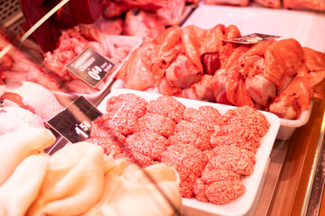Raw sheep brains on counter of butcher shop