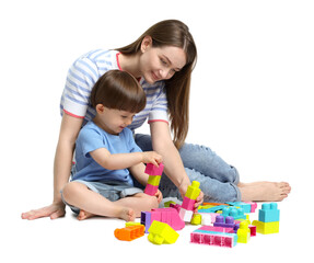 Mother and son playing with building bricks on white background