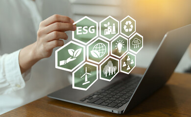 Focused women analyze corporate ESG strategy for sustainable business development social governance and environment investment goals using ESG digital icons and organization technology