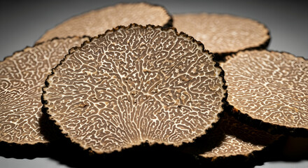 Elegant Slices Of Black Truffles Ready For Gourmet Culinary Dishes