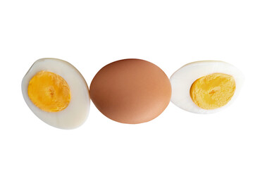 Top view of raw chicken egg and peeled cooked or boiled egg with egg yolk in two halves in stack isolated on white background with clipping path