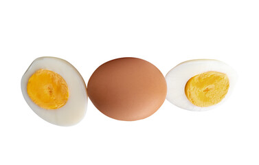 Top view of raw chicken egg and peeled cooked or boiled egg with egg yolk in two halves in stack isolated with clipping path in png file format