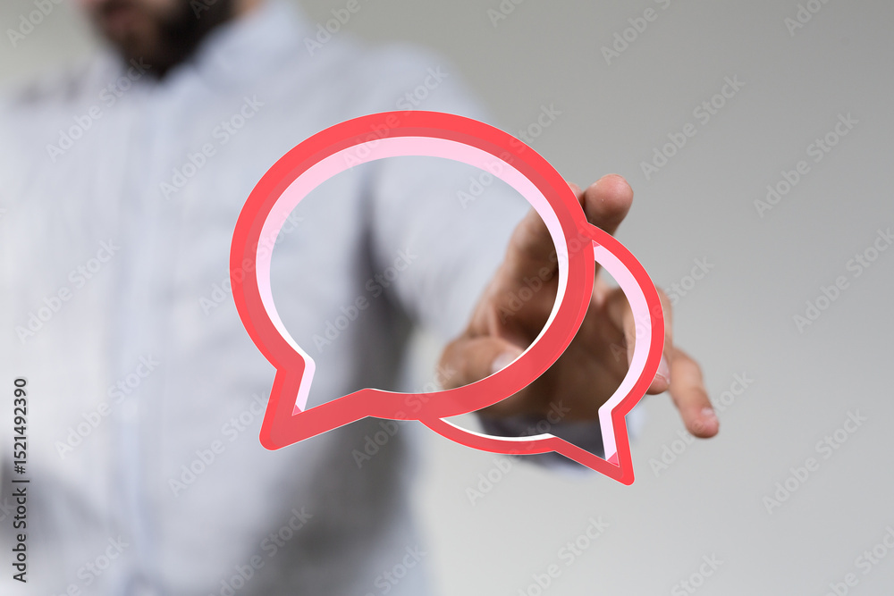 Poster image of a man holding two red speech bubbles. ideal for communication, conversation, and teamwork c