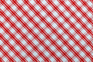Checkered red fabric. Textile. Checkered fabric background with red and white cells