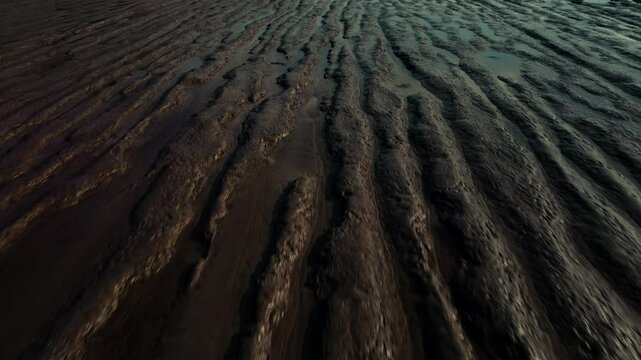 Drone shot revealing rill marks in sand on beach, Burnham-On-Sea, UK.