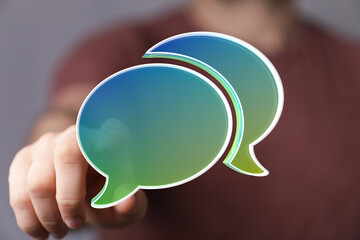 Abstract image of two speech bubbles, representing communication and conversation.