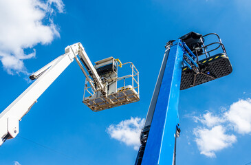 Construction equipment is positioned in a courtyard with safety cones and tools visible, ideal for...