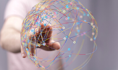 Abstract image of a hand interacting with a global network, representing connection and...
