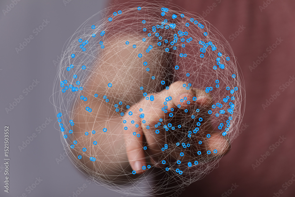 Fototapete abstract image of a hand interacting with a digital sphere representing global network connections.