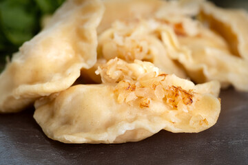 Plate with pierogi filled with cheese and potatoes, pierogi ruskie