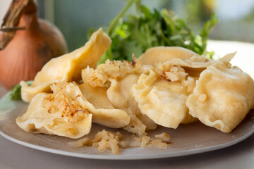 Plate with pierogi filled with cheese and potatoes, pierogi ruskie
