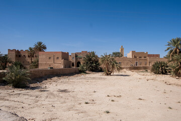 Morocco -  View of Rissani village,  traditional architecture in mud bricks,  Erg Chebbi Sahara desert, North Africa
