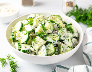 Creamy dill cucumber and onion salad, light background. AI
