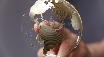 Abstract image of a hand interacting with a digital globe, representing global connections and...