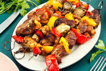 Bbq meat on skewers.