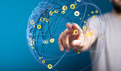 Abstract image of a hand interacting with a digital network sphere.  Represents global connections...