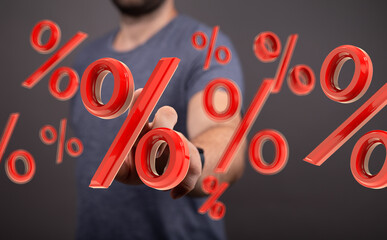 Image of a man interacting with red percentage symbols, perfect for illustrating discount, sale,...