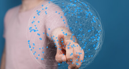 Person interacting with a digital globe, representing global network, connection, and technology.
