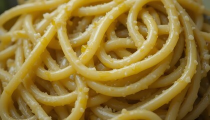 Macro of cooked pasta texture, close-up of al dente spaghetti with olive oil coating.

