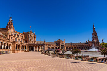 Fototapeta premium Sevilla, Spain - August 01, 2024: Plaza de Espana in Seville, Andalusia. The Plaza de Espana, built in 1928, is a plaza in the Parque de Maria Luisa in Seville, Spain.