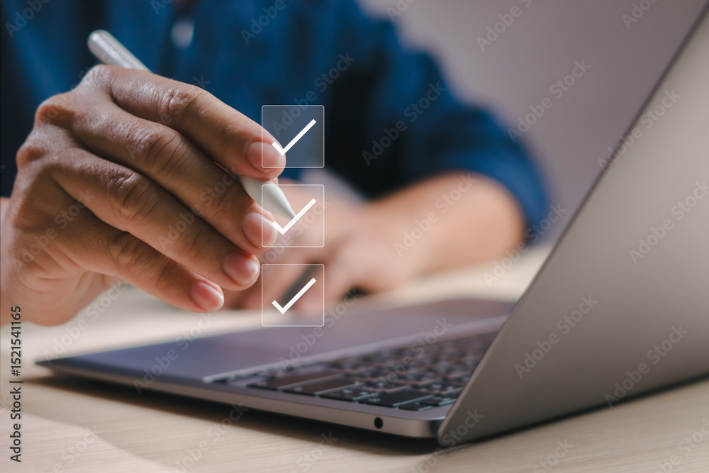 Poster businessman working with computer using pen to check boxes, fill out online survey or checklist and 