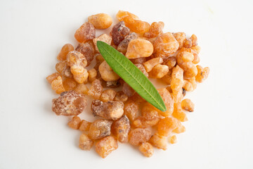 Frankincense or olibanum aromatic resin isolated on white background used in incense and perfumes.