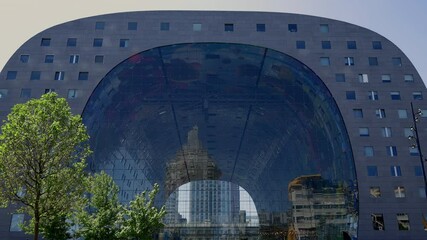 Front view of The Markthal market hall modern residential and office building architecture in Rotterdam, The Netherlands.