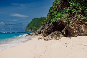 Tropical sandy beach with blue ocean in tropical island