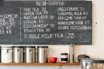 The offer of drinks on the blackboard on the wall of the coffee shop