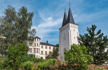 View of the former Johannisberg Monastery in the Rheingau under a white-blue sky