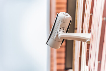 Wall-Mounted Security Camera on Brick Exterior