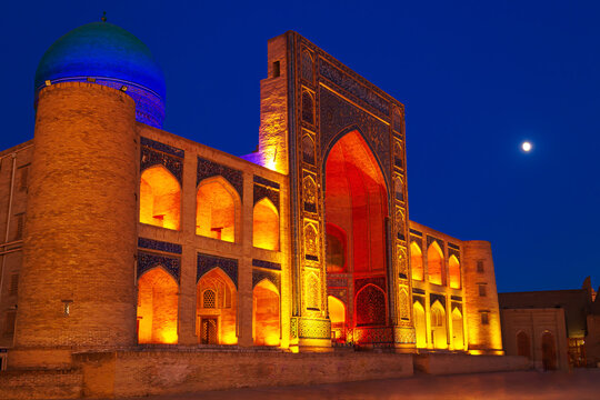 Ancient Mir-i-Arab madrasah in beautiful night illumination.