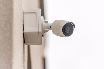 Wall mounted security camera for outdoor surveillance.