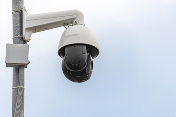 Dusty Security Camera with Spiderweb on Pole