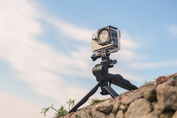 Action Camera on Tripod in Rocky Outdoor Setting