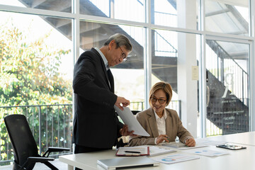 Senior businessmen analyzing data.