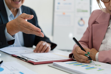 Senior businessmen analyzing data together.