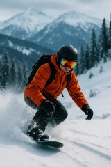 person wearing orange jacket is snowboarding down snowy mountain slope.