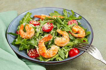 Shrimp salad with arugula and cherry tomatoes, with parmesan cheese, healthy food,