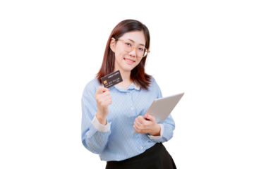 Asian young beautiful woman holding a credit card in one hand and a tablet in the other, smiling confidently.