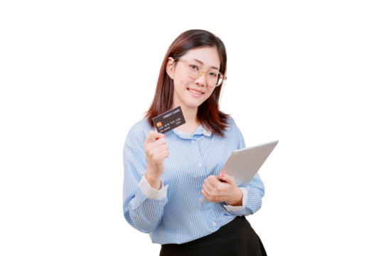 Asian young beautiful woman holding a credit card in one hand and a tablet in the other, smiling confidently.